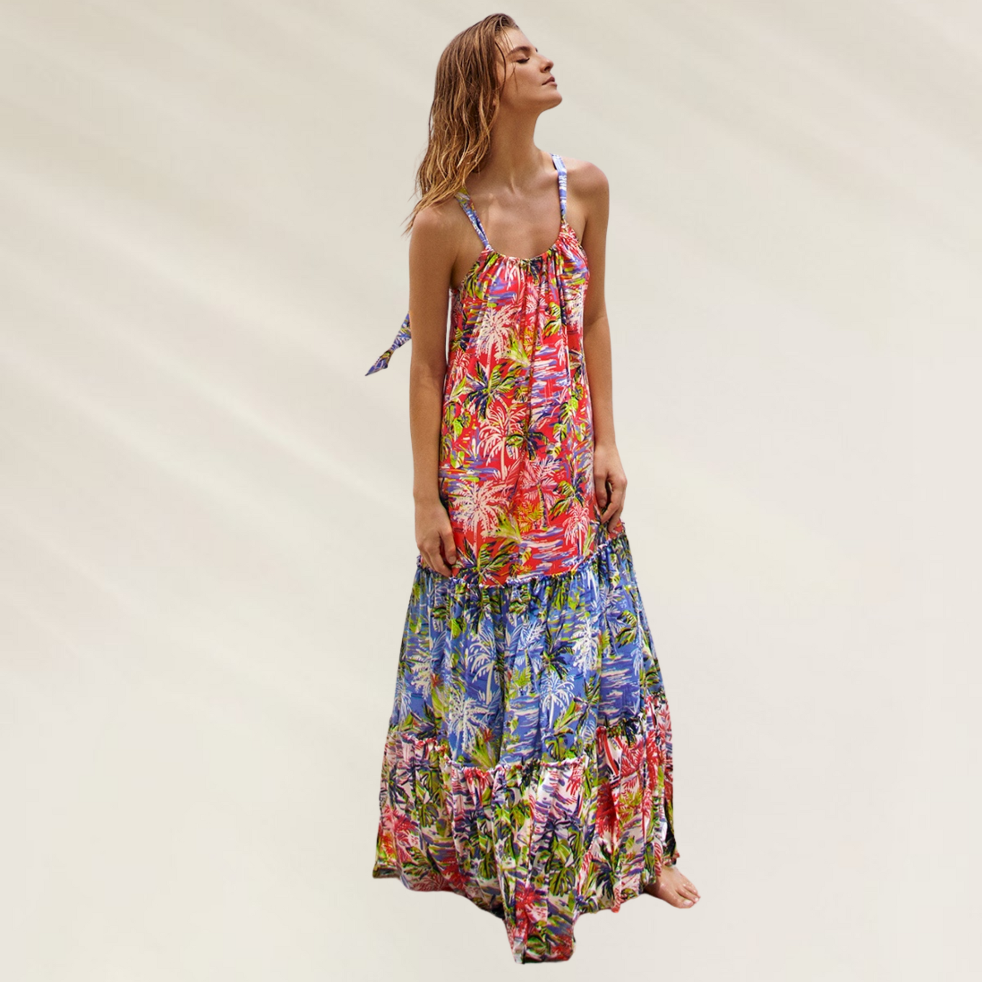 Mulher vestindo um vestido comprido florido com design tropical e fluido Um vestido leve fluido e irresistivelmente tropical Cosita Linda
