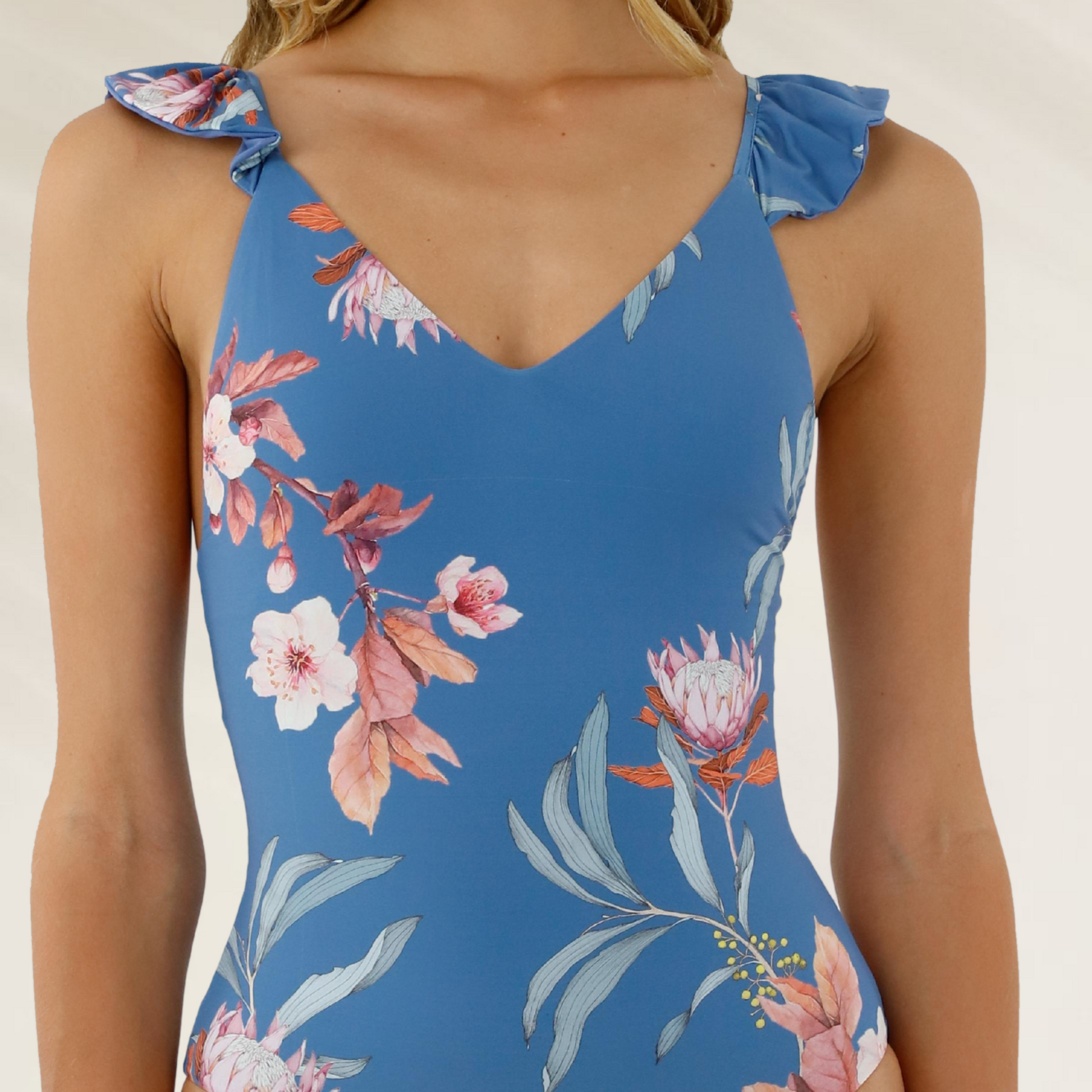 Fato de Banho Reversível Malai com Folhos e Decote em V azul com estampa floral delicada