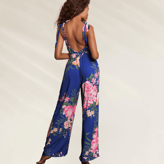 Macacão Maaji Floralia Kennedy – Beachwear Elegante com estampa floral em fundo azul e costas abertas