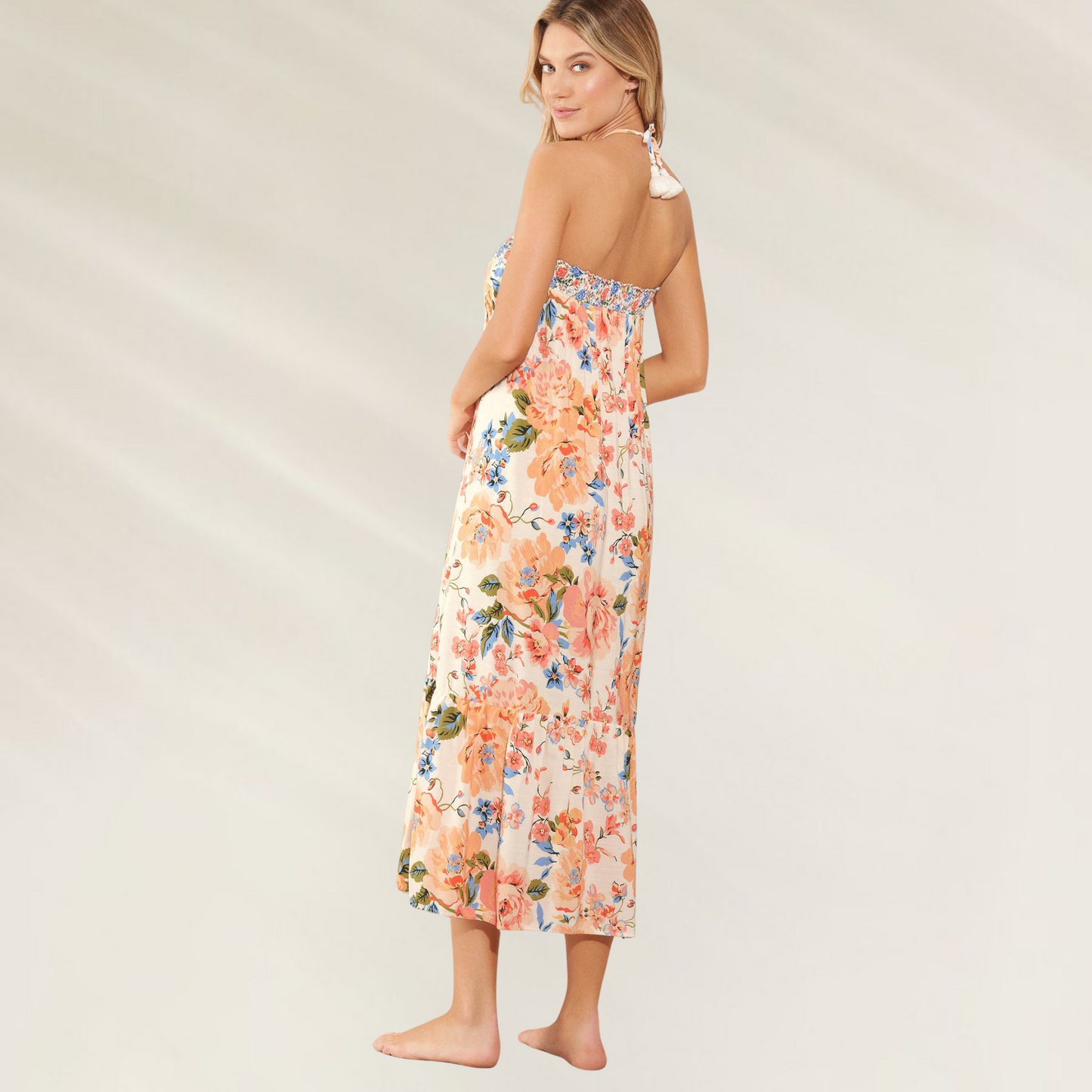 Saia/Vestido com padrão floral da Maaji em tecido leve e colorido com flores laranja e azul