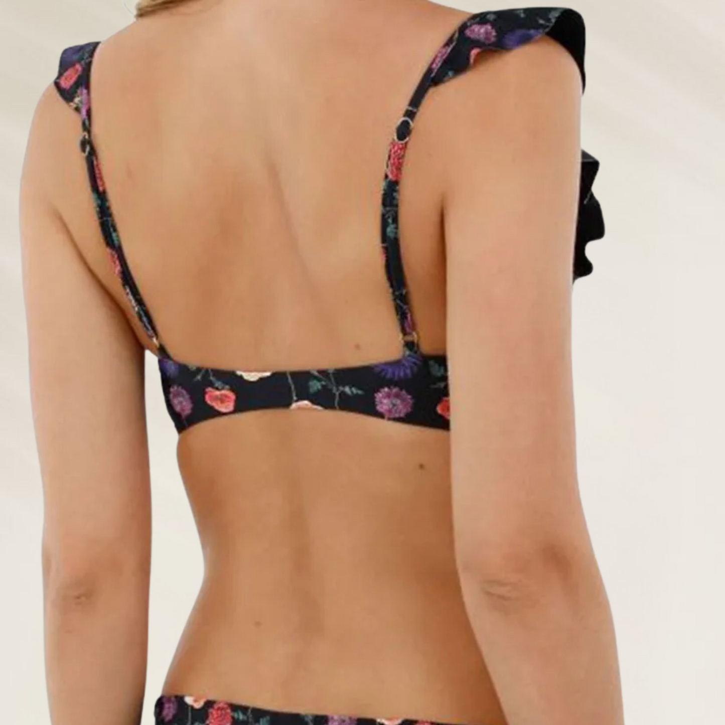 Top de Biquíni Malai com Folhos e Reversível estampado floral visto de costas com alças finas e detalhes em folhos