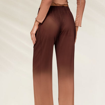Calças Mesh Transparência Ombré em tom degradê, ideais para um look moderno e elegante.