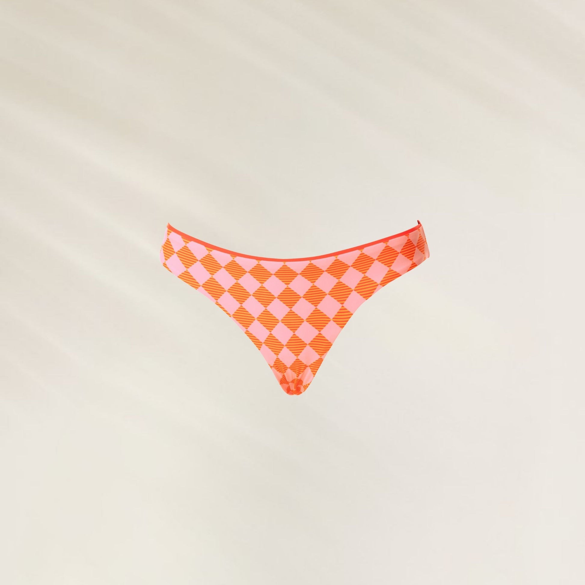 Cueca de biquíni reversível Sunset Grid Flirt em padrão de quadrados laranja para praia e piscina