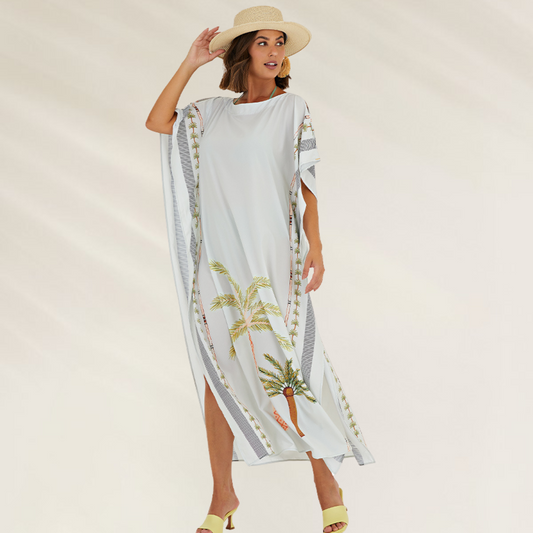 Saida de praia Debrisa Oasis Beach longa com estampa de palmeiras e detalhes elegantes