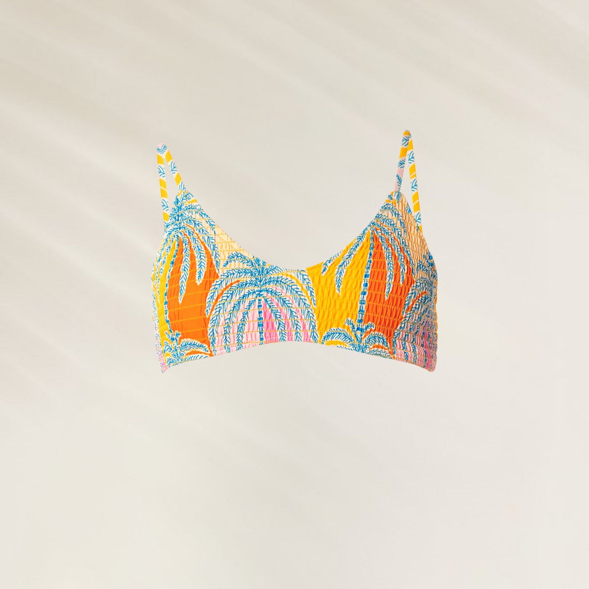 Top Desportivo Reversível Jungle Whisper colorido com estampa de palmeiras vibrantes