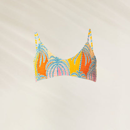 Top Desportivo Reversível Jungle Whisper colorido com estampa de palmeiras vibrantes